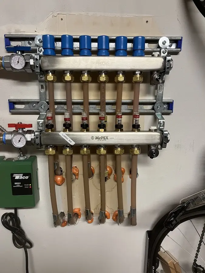 Plumber performing Water Heater Repair at a residential property in Dearborn